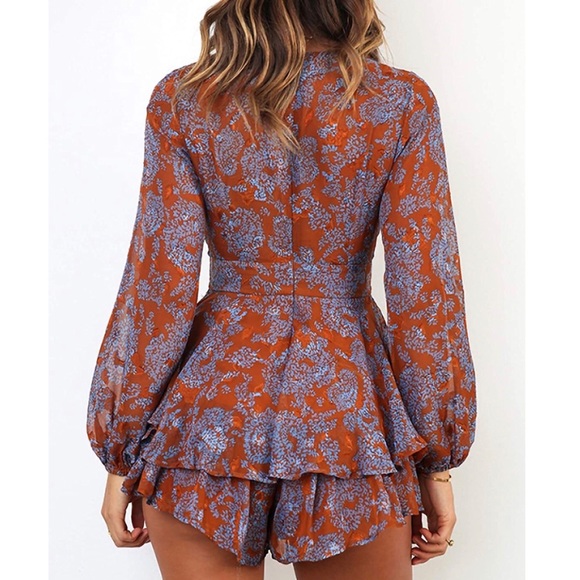 Orange floral print ruffle romper. - Picture 2 of 4